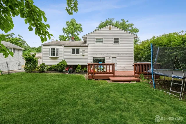 a front view of a house with patio and garden