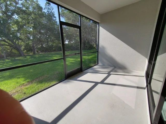 a view of a grassy field with trees