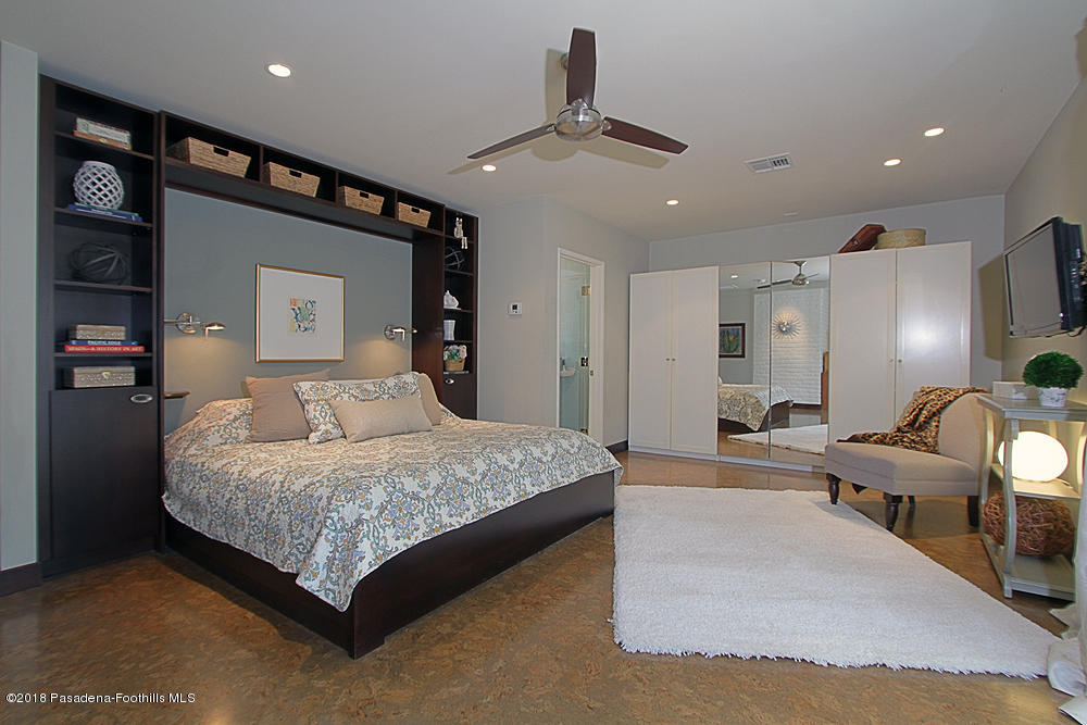 3775 Shadow Grove Road Pasadena, CA 91107 - Photo 13 of 33 a bedroom with a bed and a chandelier