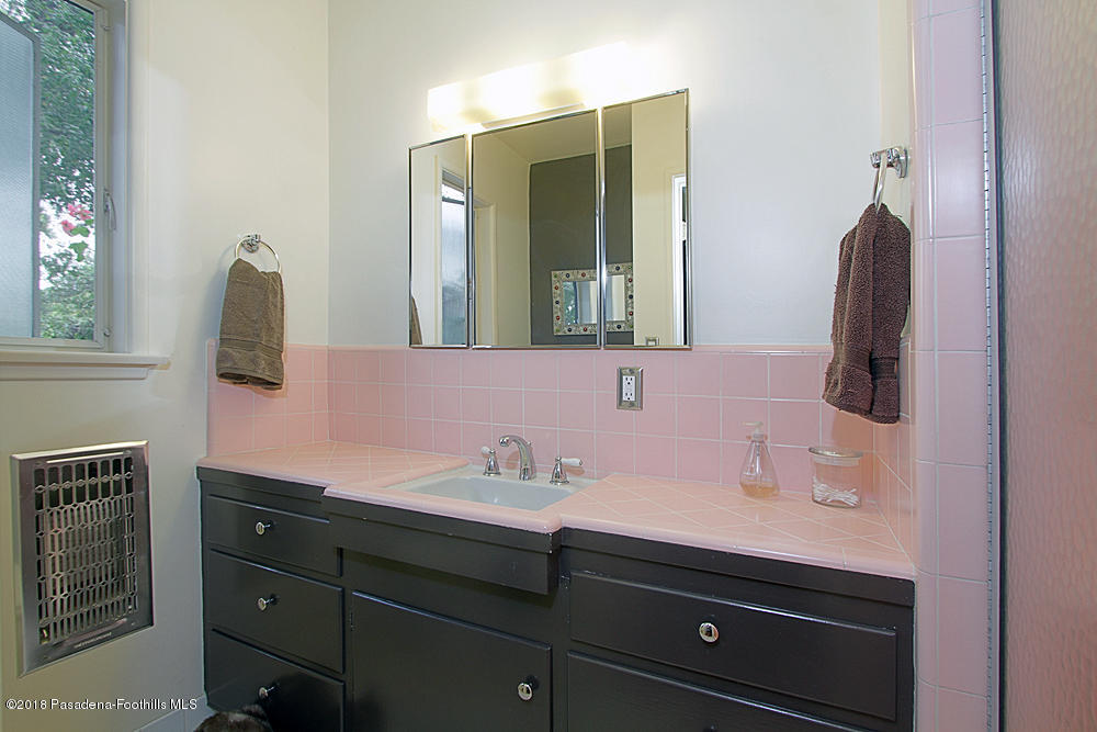 3775 Shadow Grove Road Pasadena, CA 91107 - Photo 17 of 33 a bathroom with a sink and a mirror