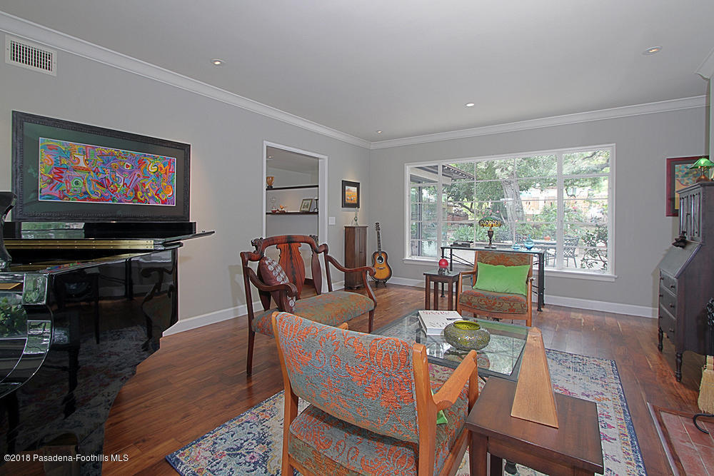3775 Shadow Grove Road Pasadena, CA 91107 - Photo 8 of 33 a living room with furniture a flat screen tv and a large window
