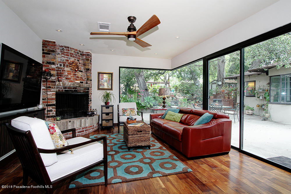 3775 Shadow Grove Road Pasadena, CA 91107 - Photo 9 of 33 a living room with fireplace furniture and a flat screen tv