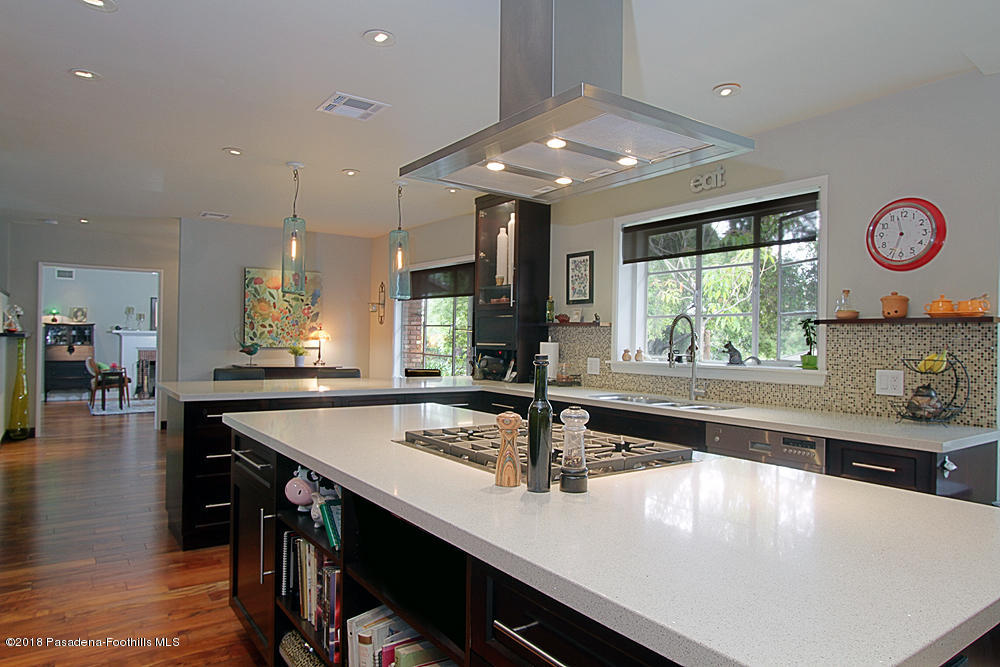 3775 Shadow Grove Road Pasadena, CA 91107 - Photo 10 of 33 a large kitchen with stainless steel appliances a large counter top a stove and a sink