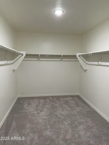 a room with a furniture and a ceiling fan