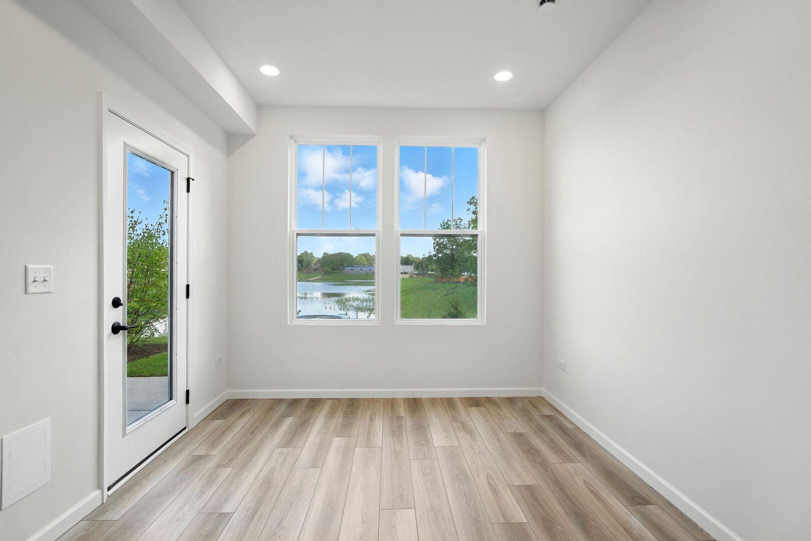 1062 Houston Street, Unit 74004 Batavia, IL 60510 - Photo 13 of 23 a view of a room with wooden floor and a window