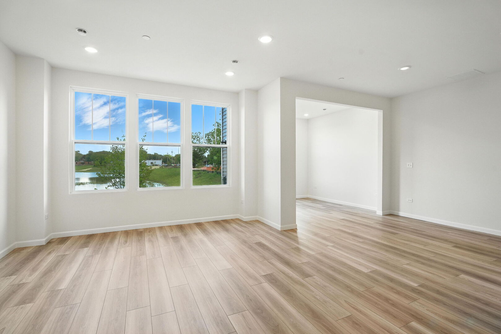 1062 Houston Street, Unit 74004 Batavia, IL 60510 - Photo 14 of 23 a view of an empty room with wooden floor and a window