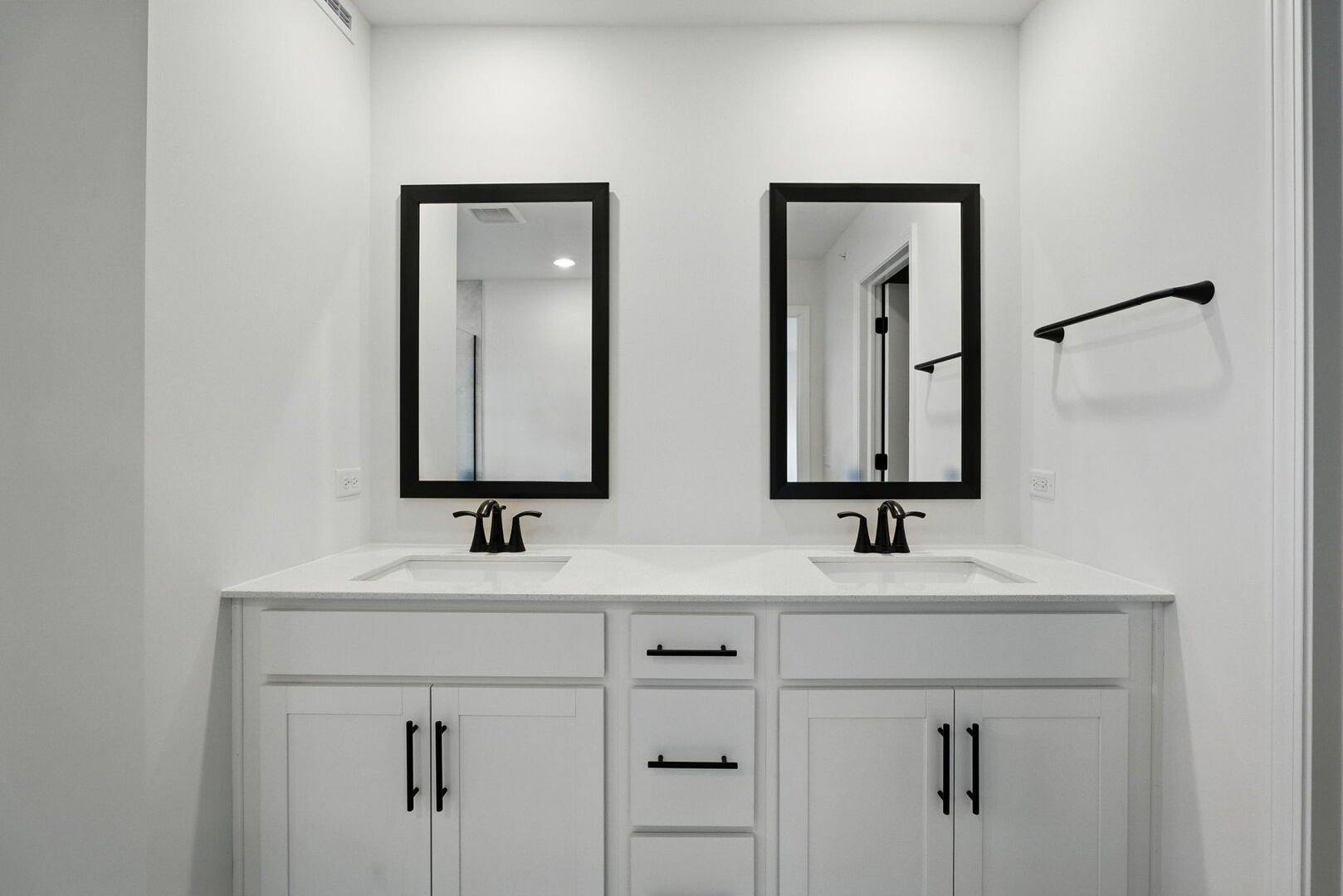 1062 Houston Street, Unit 74004 Batavia, IL 60510 - Photo 15 of 23 a bathroom with double vanity sinks and a mirror