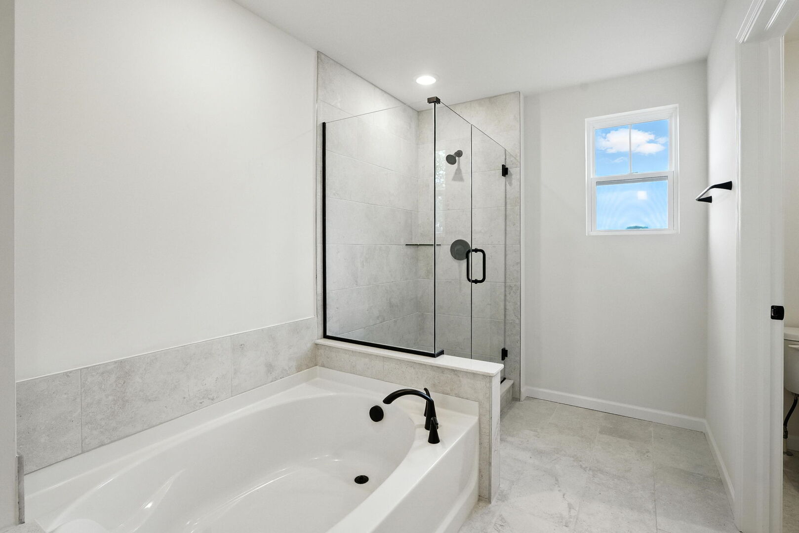 1062 Houston Street, Unit 74004 Batavia, IL 60510 - Photo 17 of 23 a bathroom with a bathtub and a shower