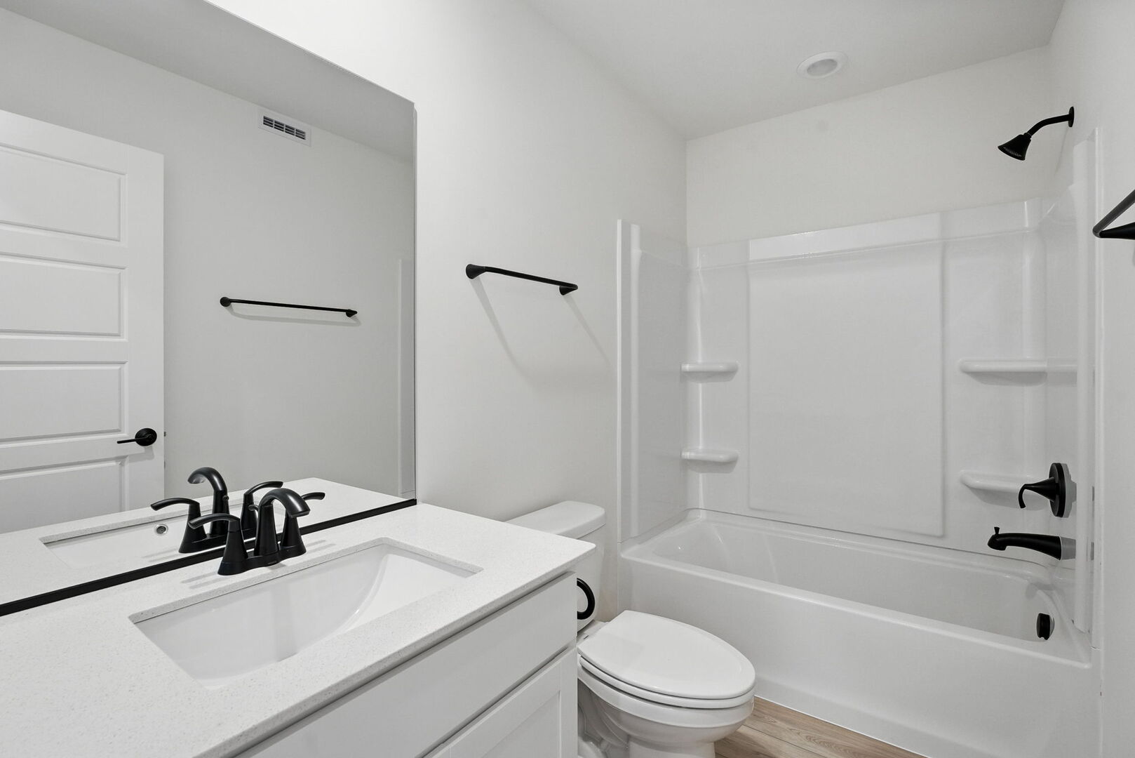 1062 Houston Street, Unit 74004 Batavia, IL 60510 - Photo 21 of 23 a bathroom with a sink a toilet and a bathtub