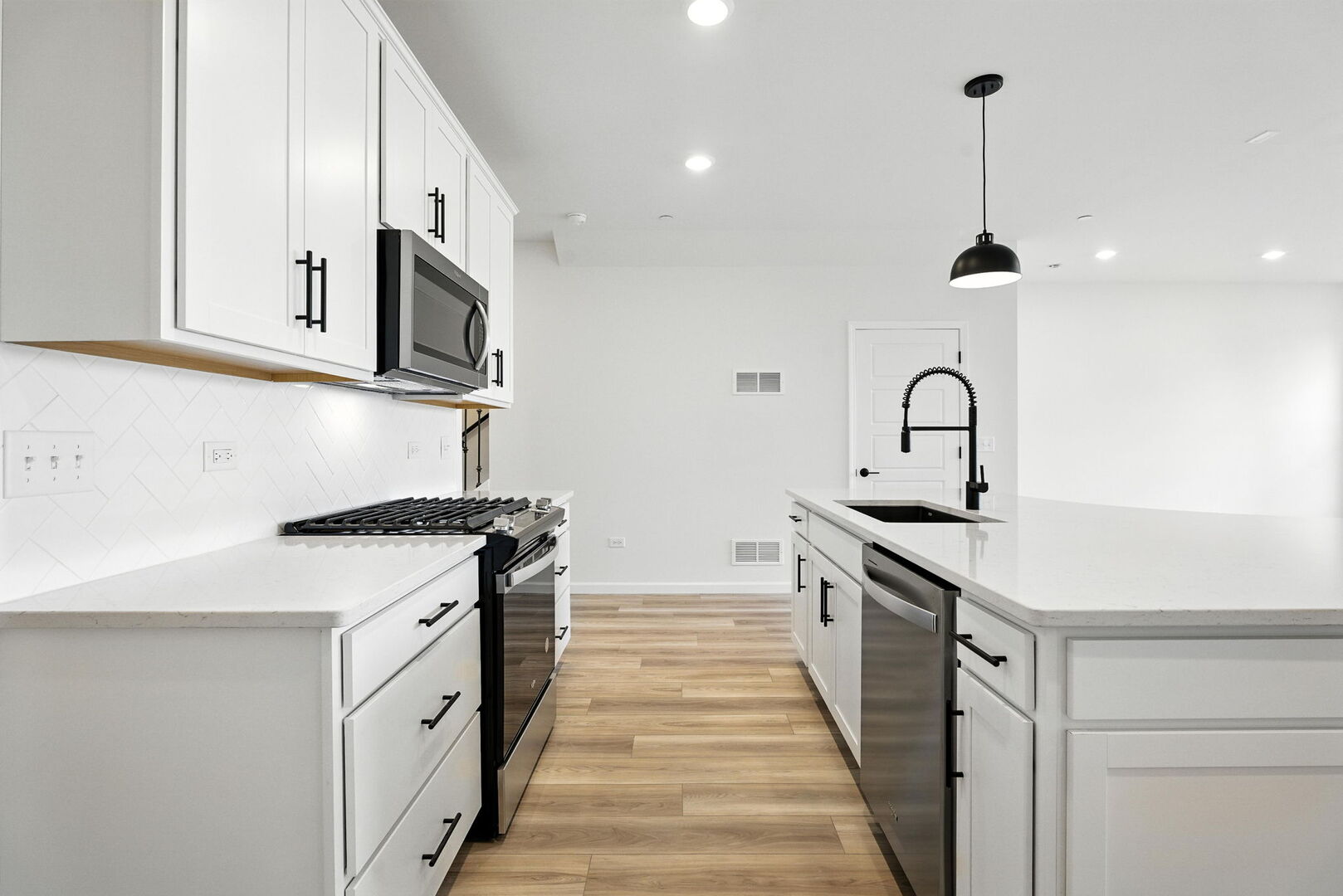 1062 Houston Street, Unit 74004 Batavia, IL 60510 - Photo 5 of 23 a kitchen with stainless steel appliances a sink stove and cabinets