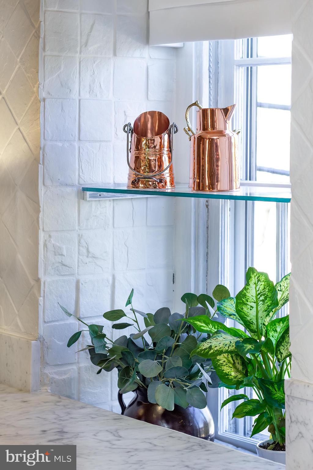 10108 Falls Road Lutherville-Timonium, MD 21093 - Photo 11 of 55 a potted plant sitting on top of a wooden door