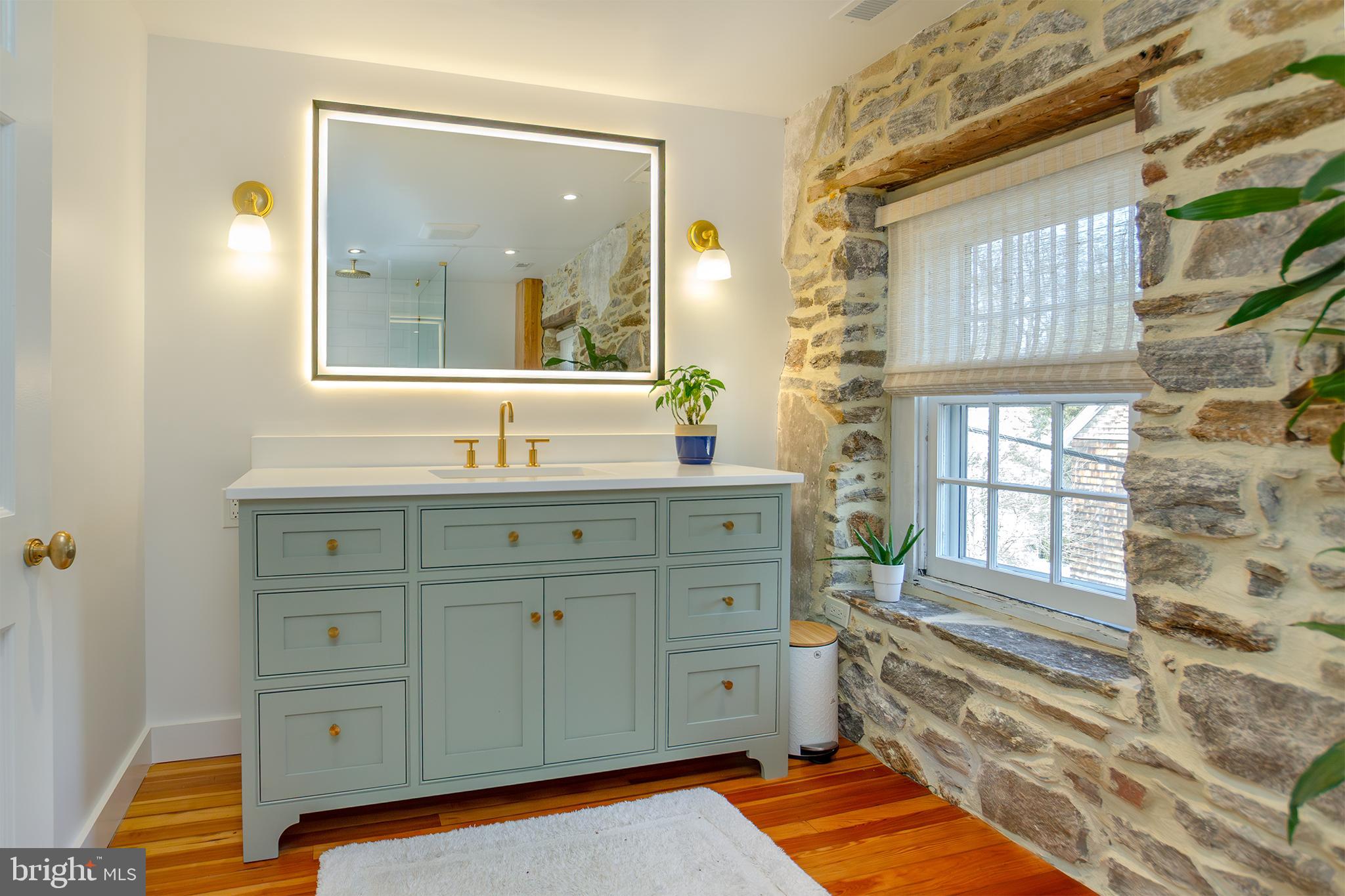 10108 Falls Road Lutherville-Timonium, MD 21093 - Photo 16 of 55 a bathroom with a sink and a mirror