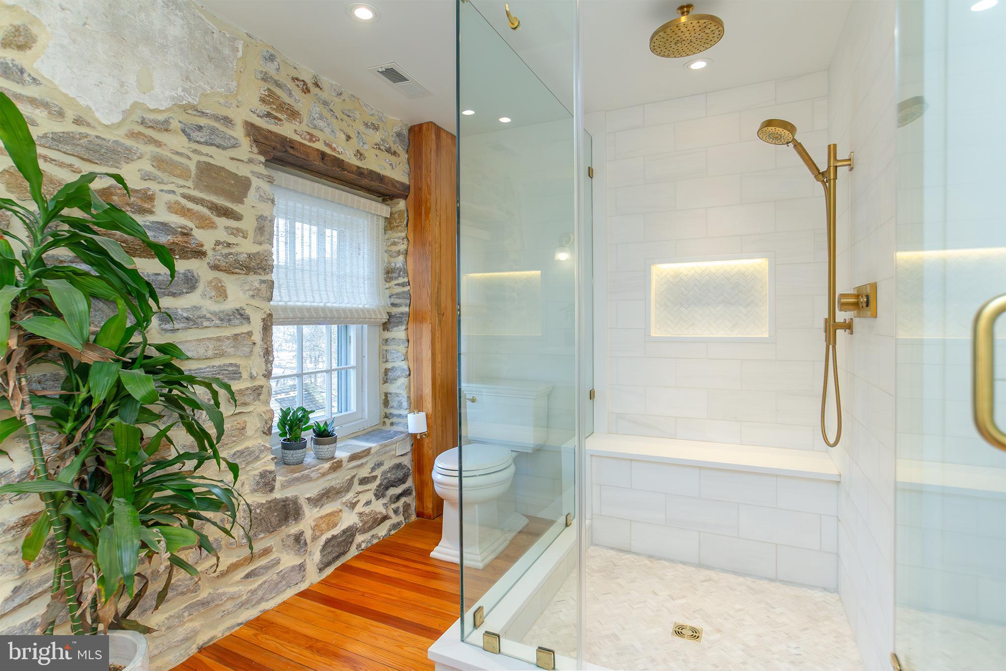 10108 Falls Road Lutherville-Timonium, MD 21093 - Photo 18 of 55 a spacious bathroom with a bathtub and a shower