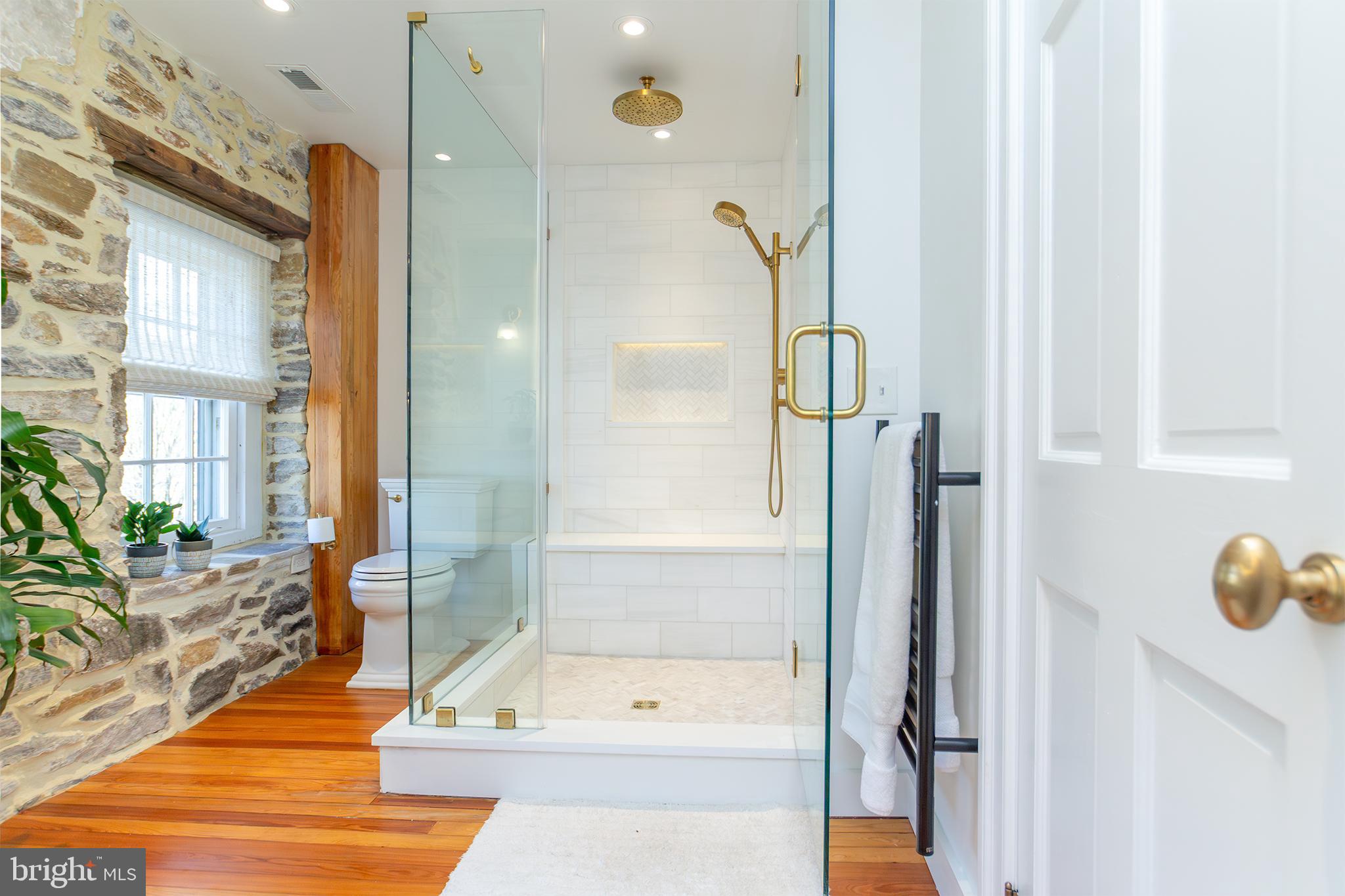 10108 Falls Road Lutherville-Timonium, MD 21093 - Photo 19 of 55 a bathroom with a tub and shower