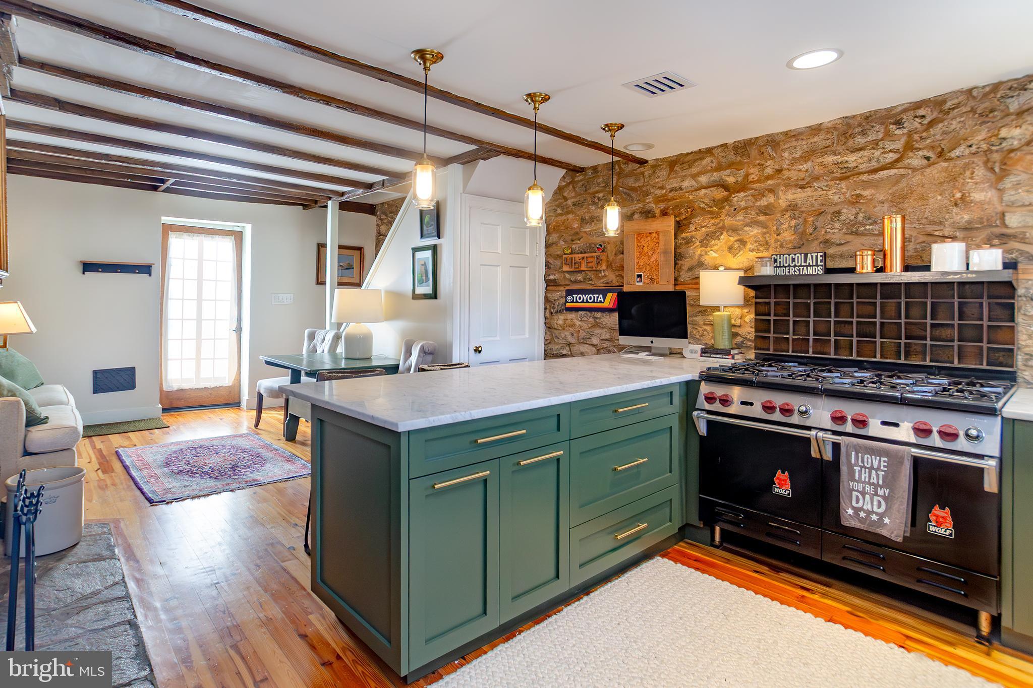 10108 Falls Road Lutherville-Timonium, MD 21093 - Photo 2 of 55 a kitchen with a stove and a microwave