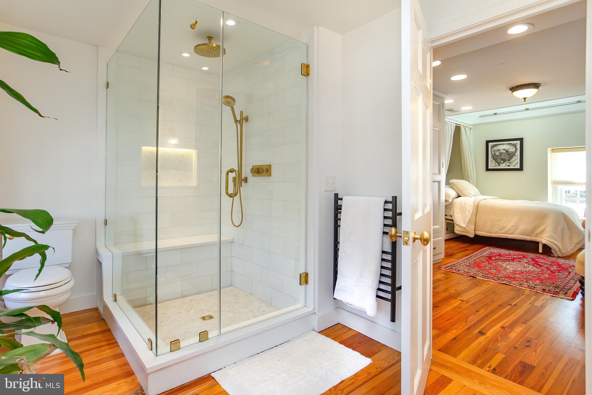 10108 Falls Road Lutherville-Timonium, MD 21093 - Photo 23 of 55 a bathroom with a tub and shower