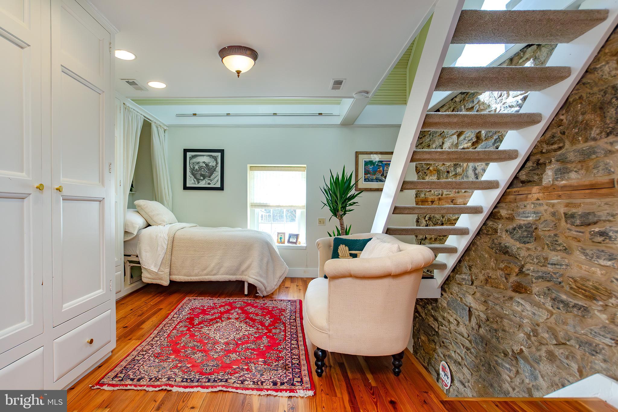 10108 Falls Road Lutherville-Timonium, MD 21093 - Photo 26 of 55 a bedroom with furniture and a rug