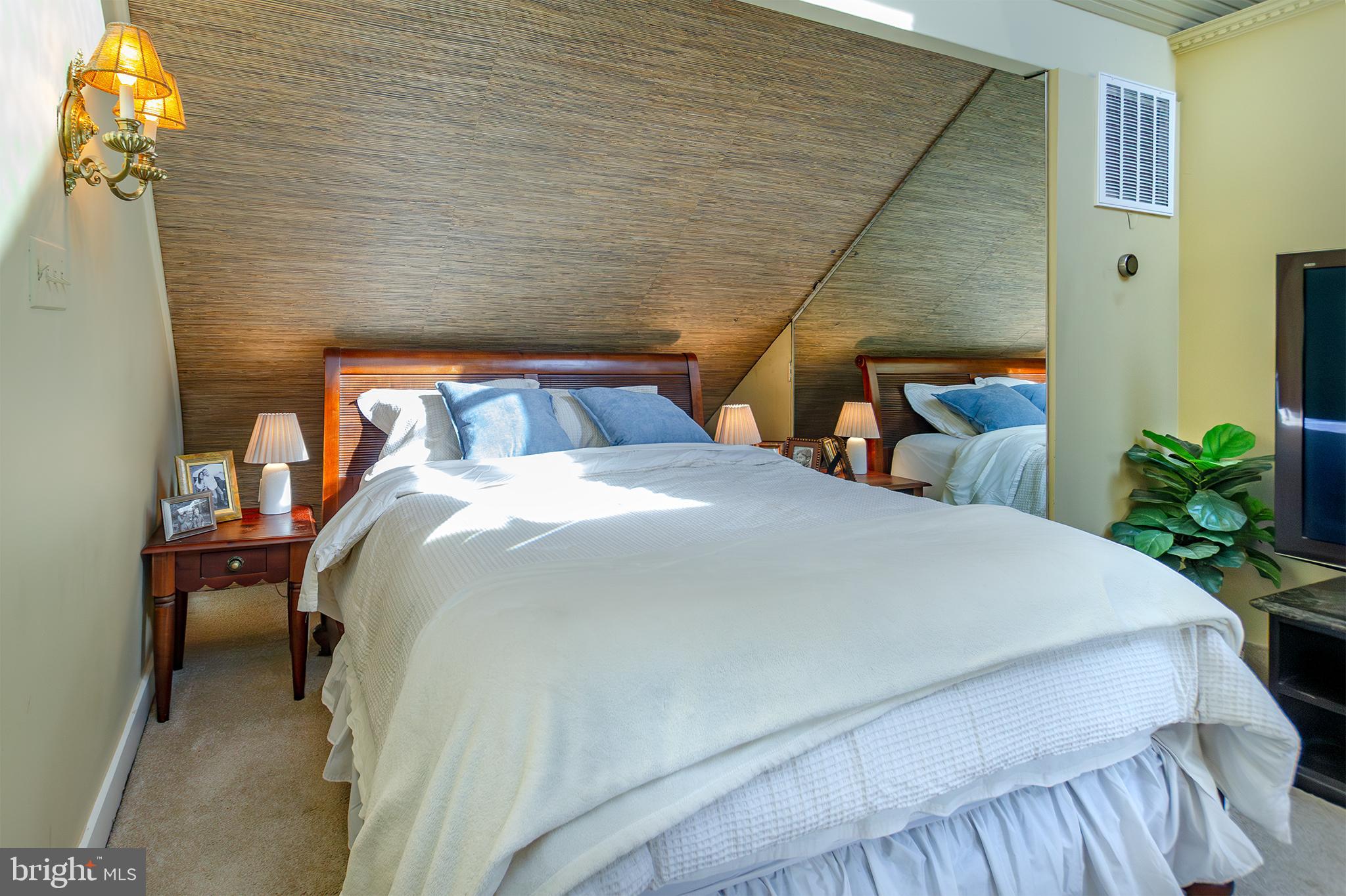 10108 Falls Road Lutherville-Timonium, MD 21093 - Photo 29 of 55 a bed sitting in a bedroom next to a larger window