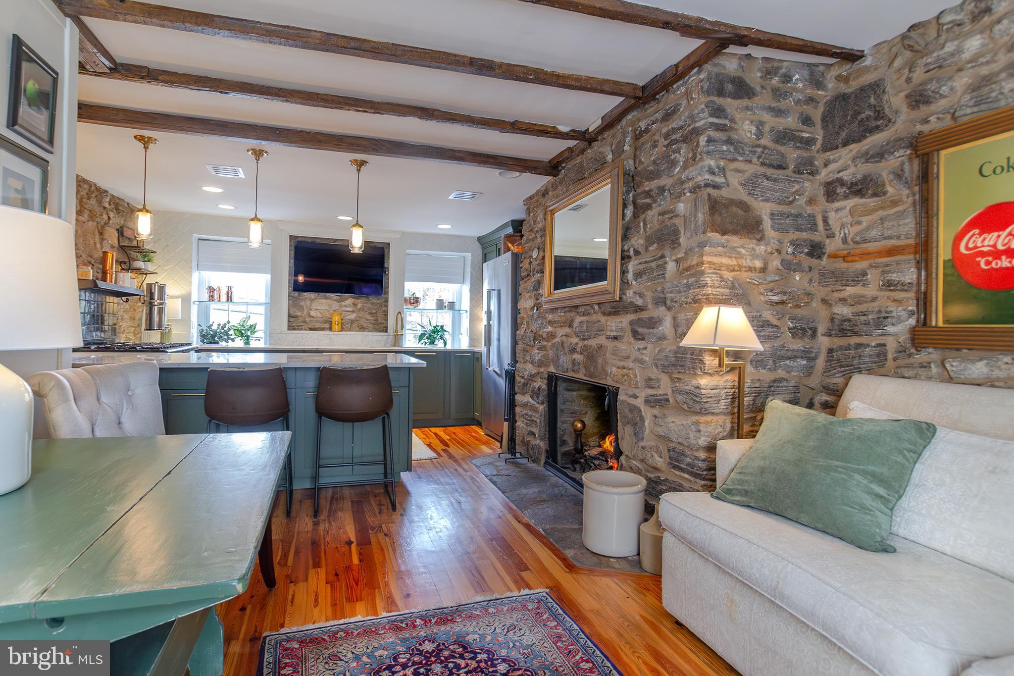 10108 Falls Road Lutherville-Timonium, MD 21093 - Photo 3 of 55 a living room with furniture and a fireplace