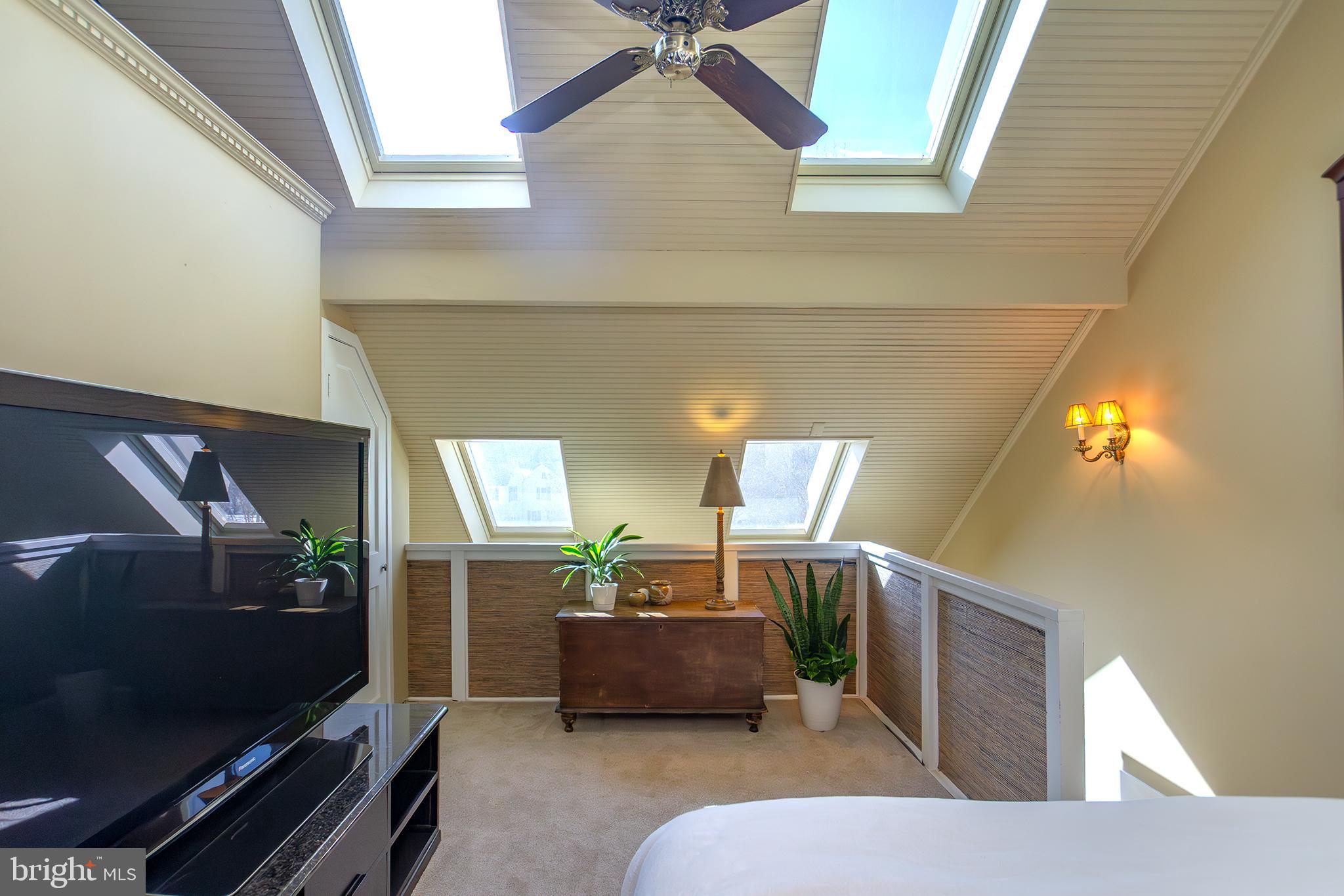 10108 Falls Road Lutherville-Timonium, MD 21093 - Photo 34 of 55 a living room with furniture and a flat screen tv
