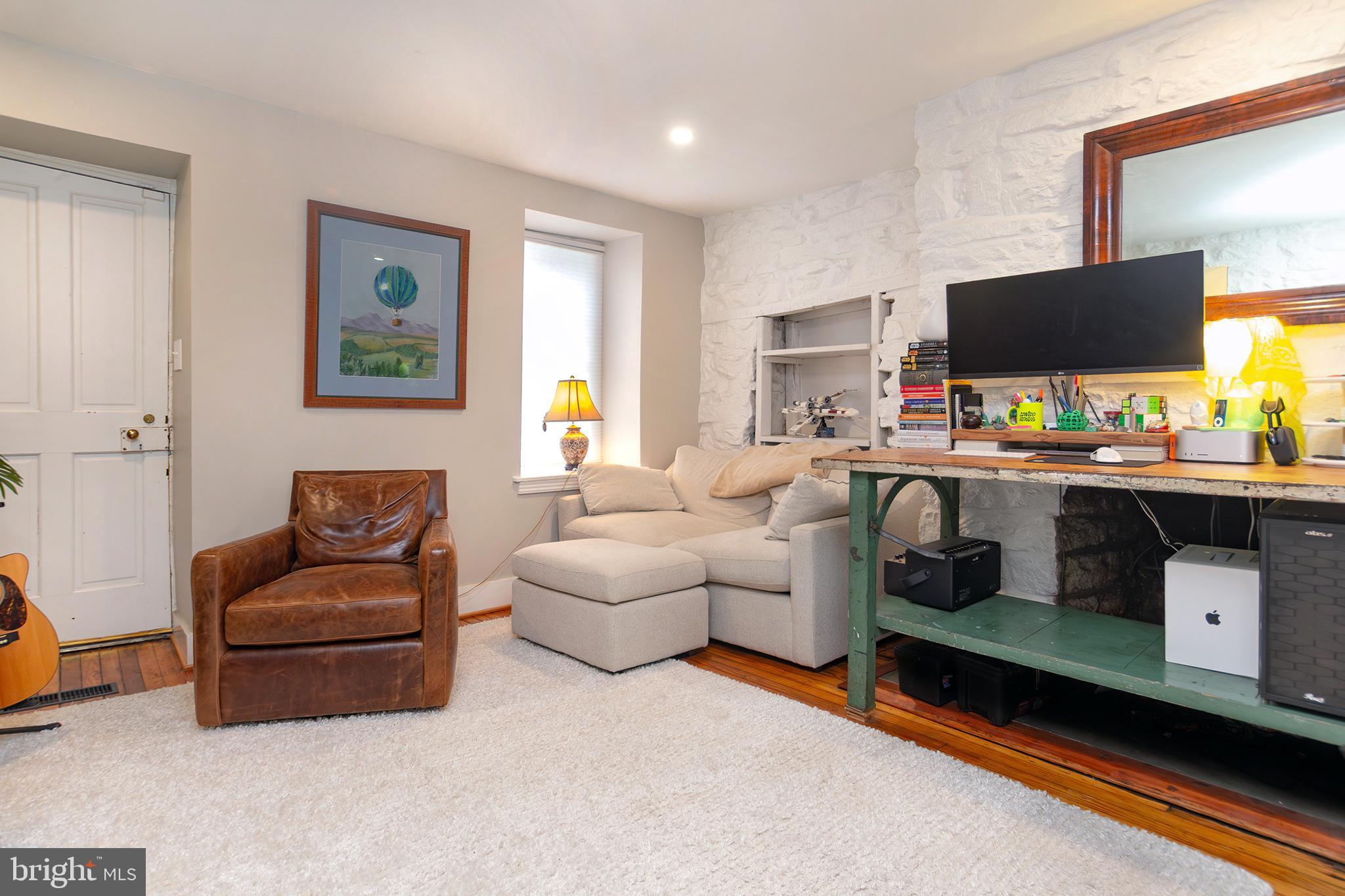 10108 Falls Road Lutherville-Timonium, MD 21093 - Photo 37 of 55 a living room with furniture and a flat screen tv
