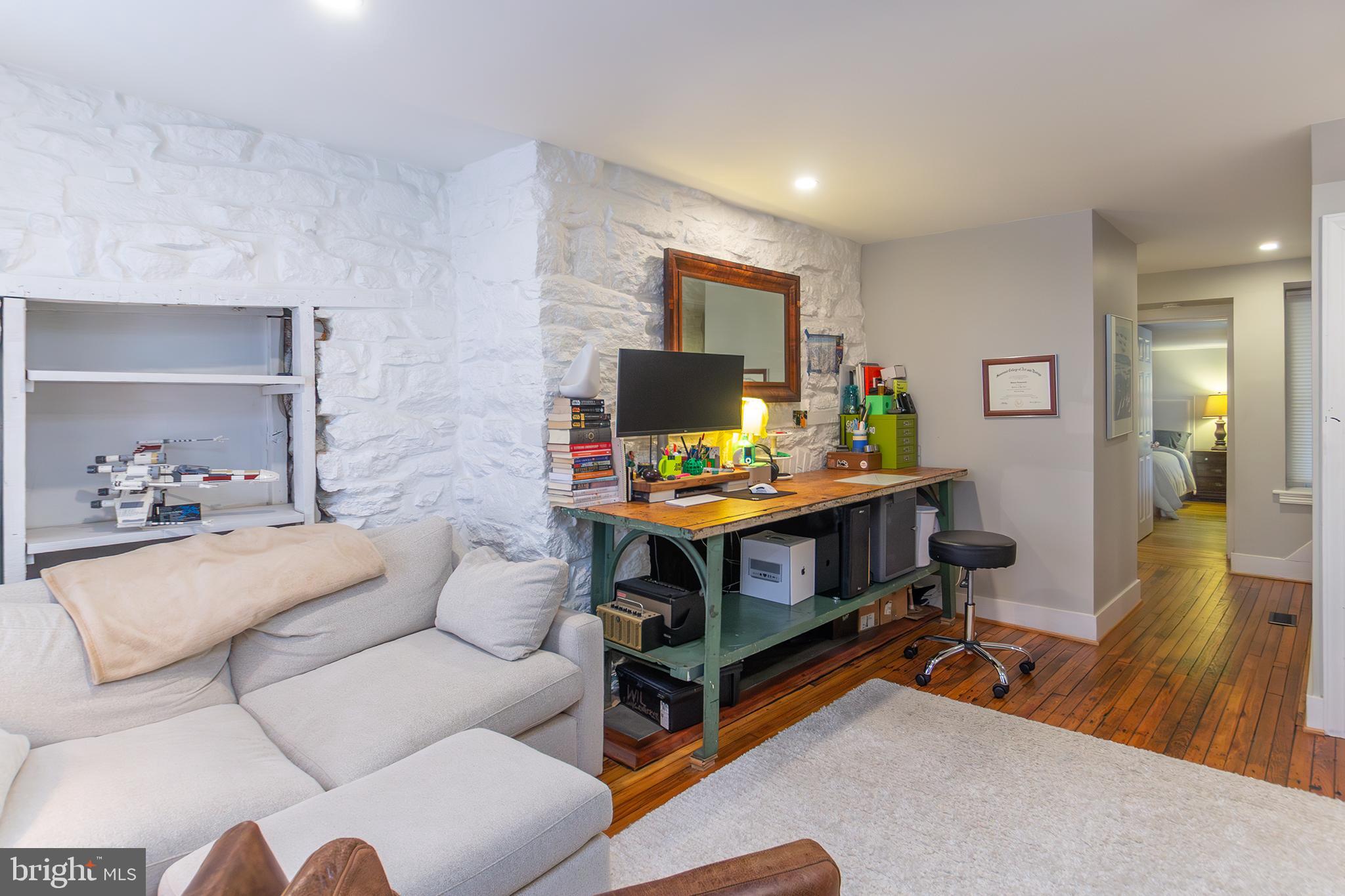 10108 Falls Road Lutherville-Timonium, MD 21093 - Photo 39 of 55 a living room with furniture and a flat screen tv