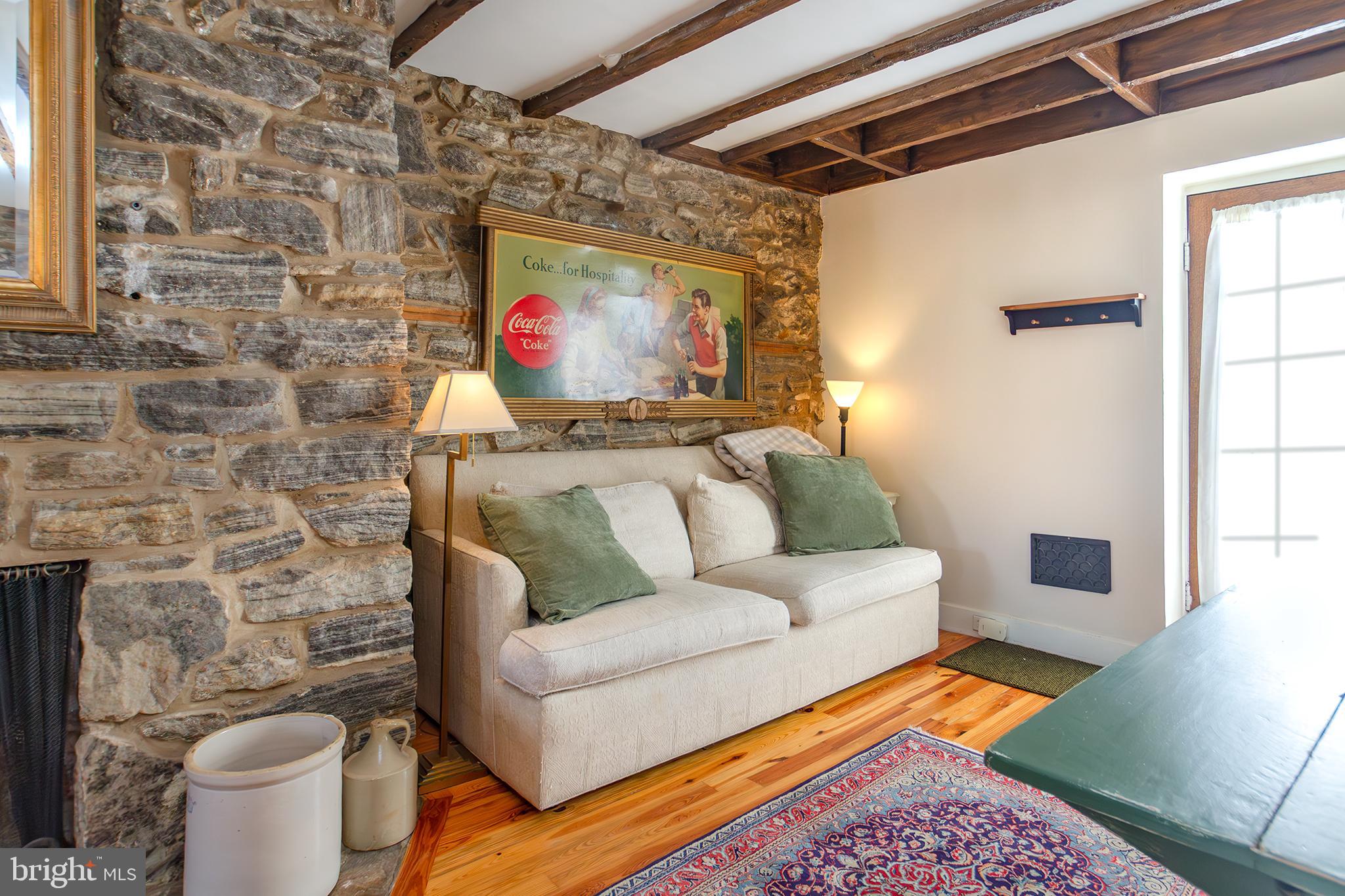 10108 Falls Road Lutherville-Timonium, MD 21093 - Photo 4 of 55 a living room with furniture and a rug