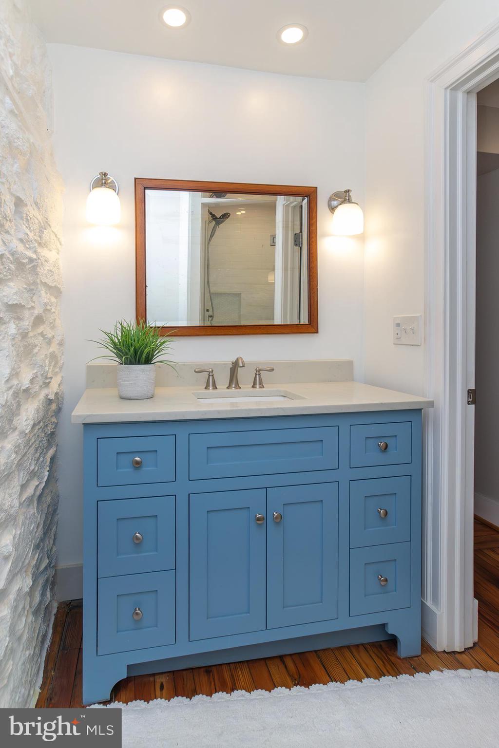 10108 Falls Road Lutherville-Timonium, MD 21093 - Photo 41 of 55 a bathroom with a sink and a mirror