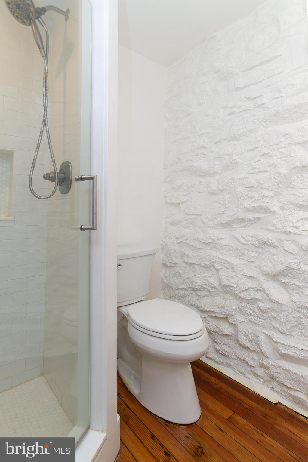 10108 Falls Road Lutherville-Timonium, MD 21093 - Photo 42 of 55 a bathroom with a toilet and a shower