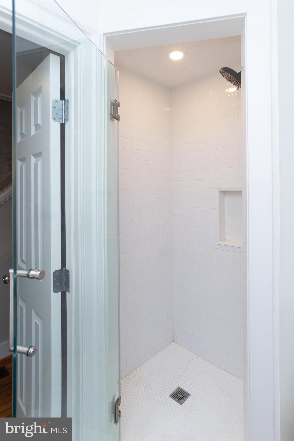 10108 Falls Road Lutherville-Timonium, MD 21093 - Photo 43 of 55 a bathroom with a shower