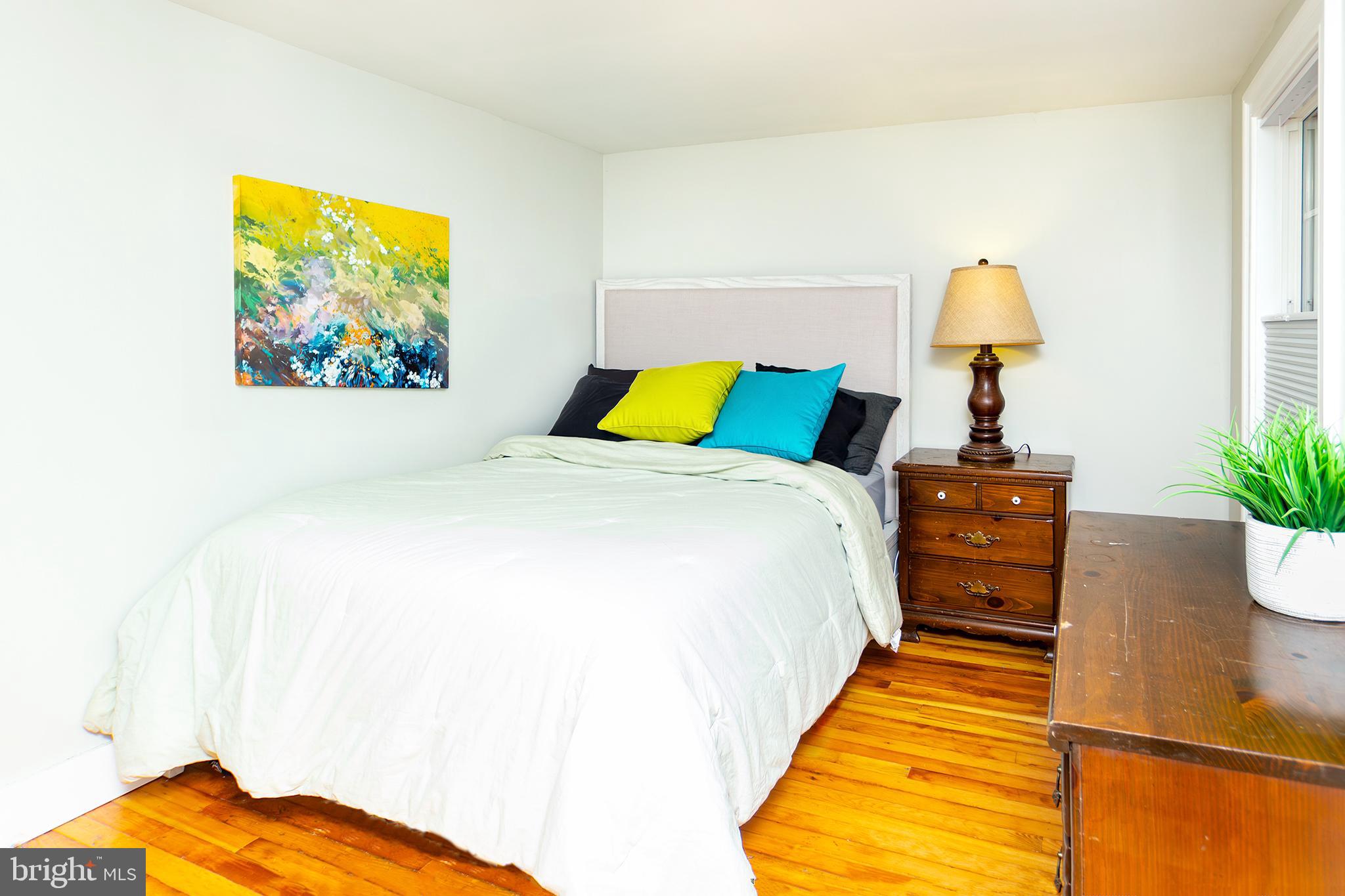 10108 Falls Road Lutherville-Timonium, MD 21093 - Photo 45 of 55 a bed sitting in a bedroom next to a window