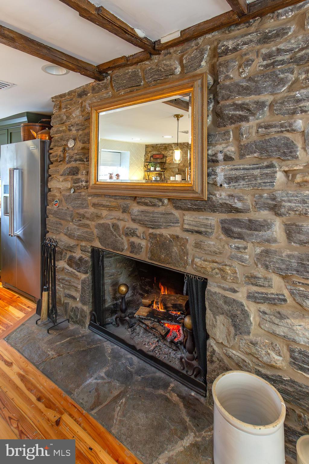 10108 Falls Road Lutherville-Timonium, MD 21093 - Photo 9 of 55 a living room with a fireplace and a wooden floor