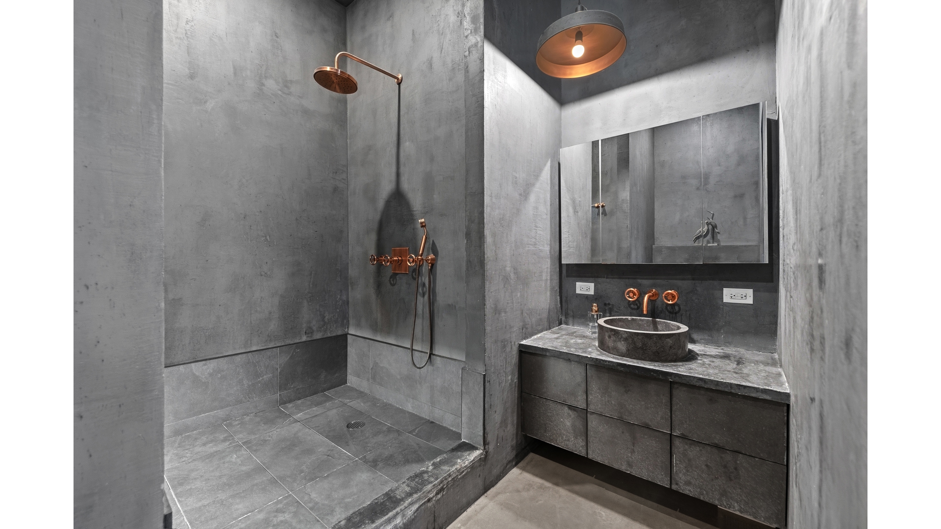448 West 37th Street, Unit 9G Manhattan, NY 10018 - Photo 10 of 15 a bathroom with a sink and a mirror