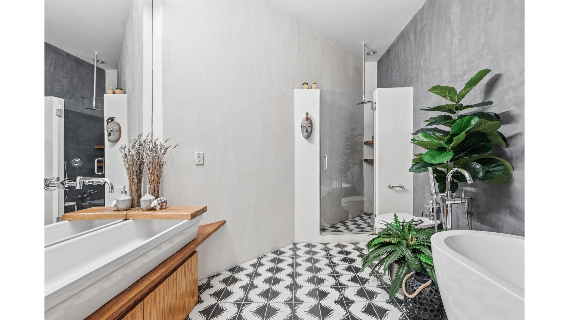 448 West 37th Street, Unit 9G Manhattan, NY 10018 - Photo 12 of 15 a room with a potted plant on a counter and a chair