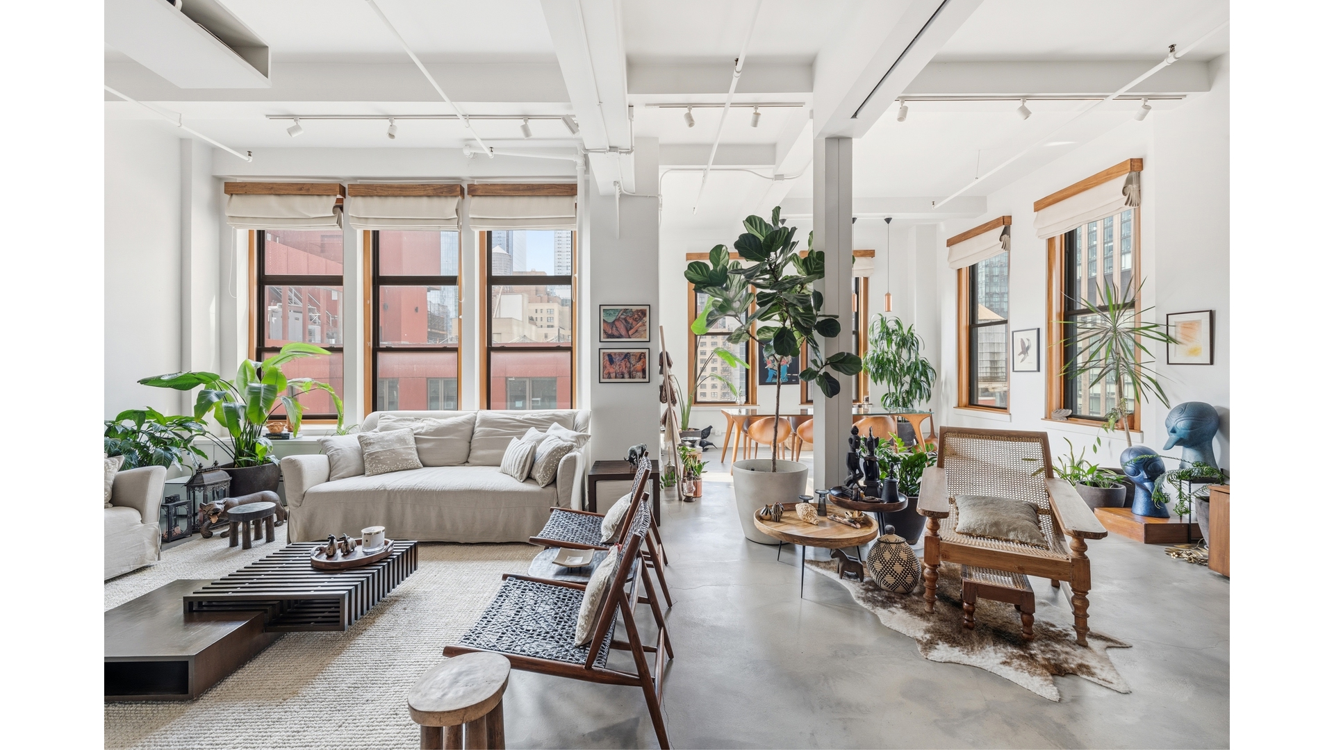 448 West 37th Street, Unit 9G Manhattan, NY 10018 - Photo 2 of 15 a living room with furniture and a large window