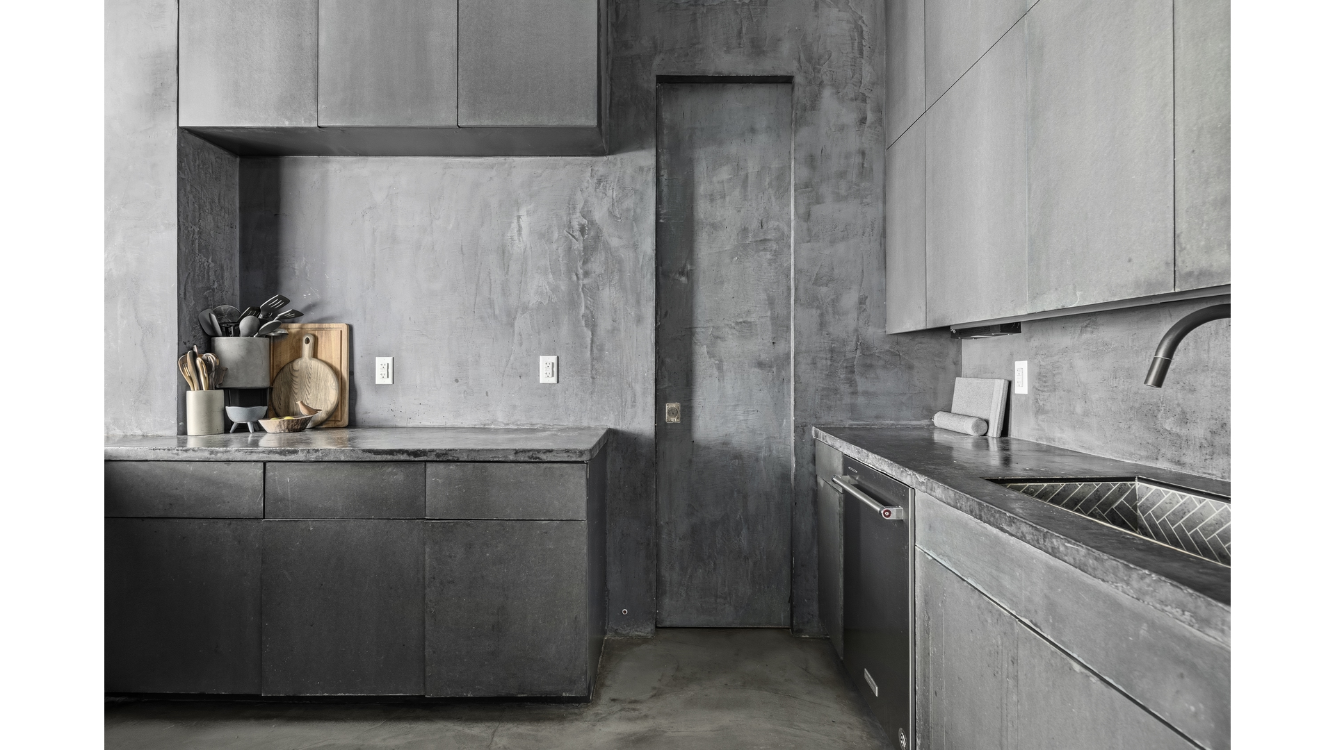 448 West 37th Street, Unit 9G Manhattan, NY 10018 - Photo 6 of 15 a kitchen with a sink and cabinets