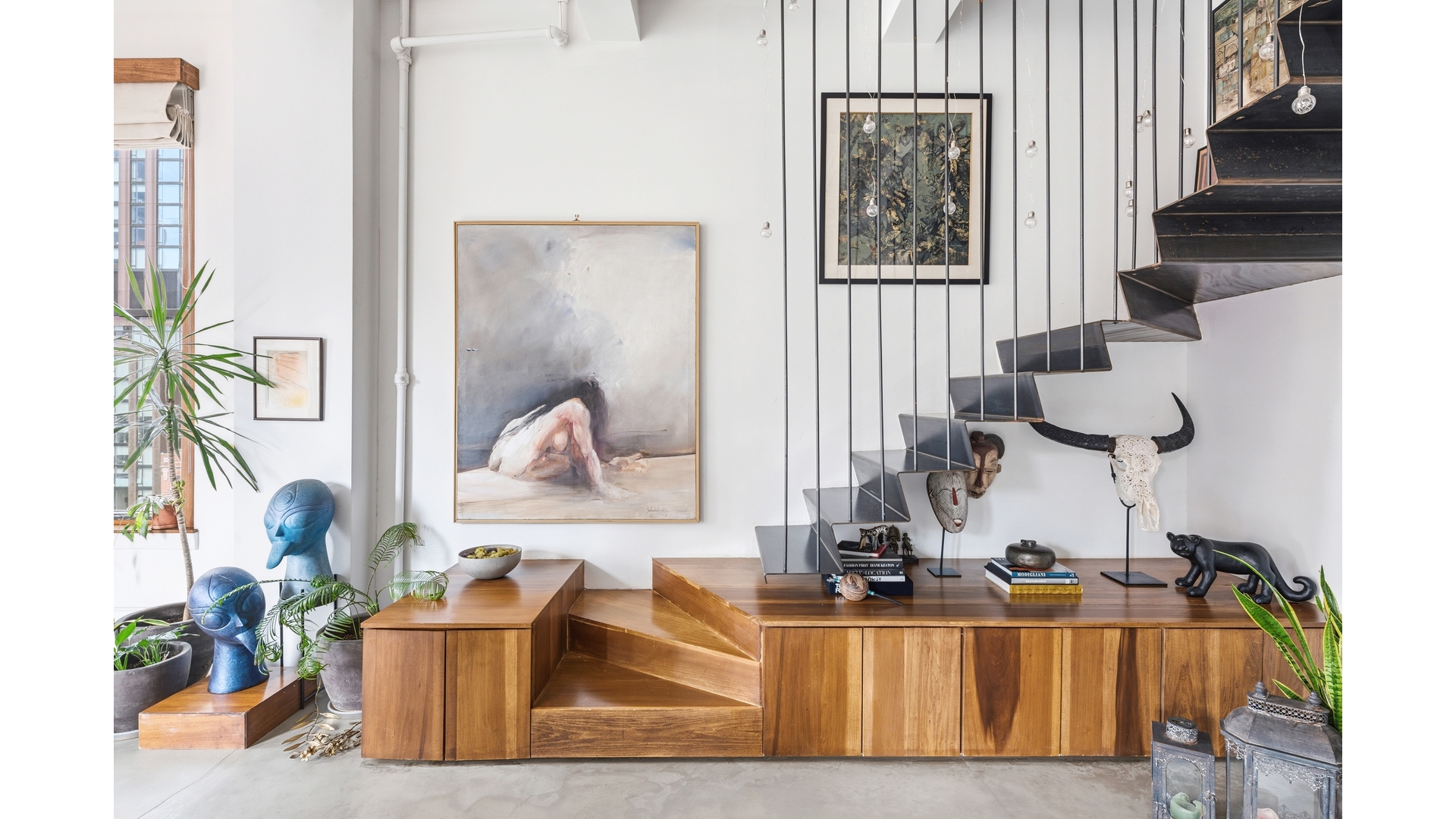 448 West 37th Street, Unit 9G Manhattan, NY 10018 - Photo 7 of 15 a living room with furniture and a painting on the wall