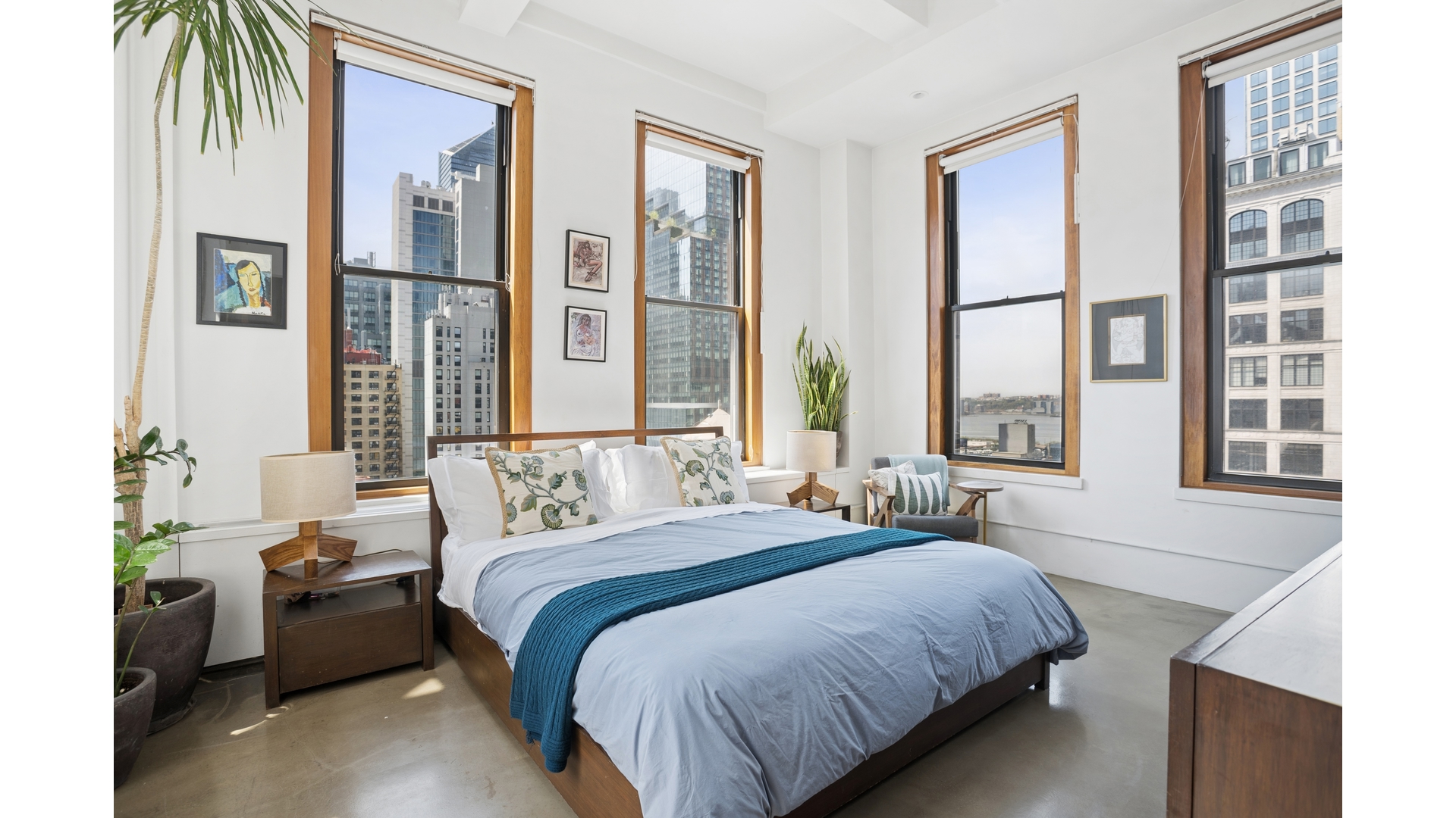 448 West 37th Street, Unit 9G Manhattan, NY 10018 - Photo 8 of 15 a bedroom with a bed and a large window
