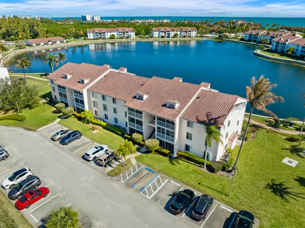 an aerial view of a house with a ocean view