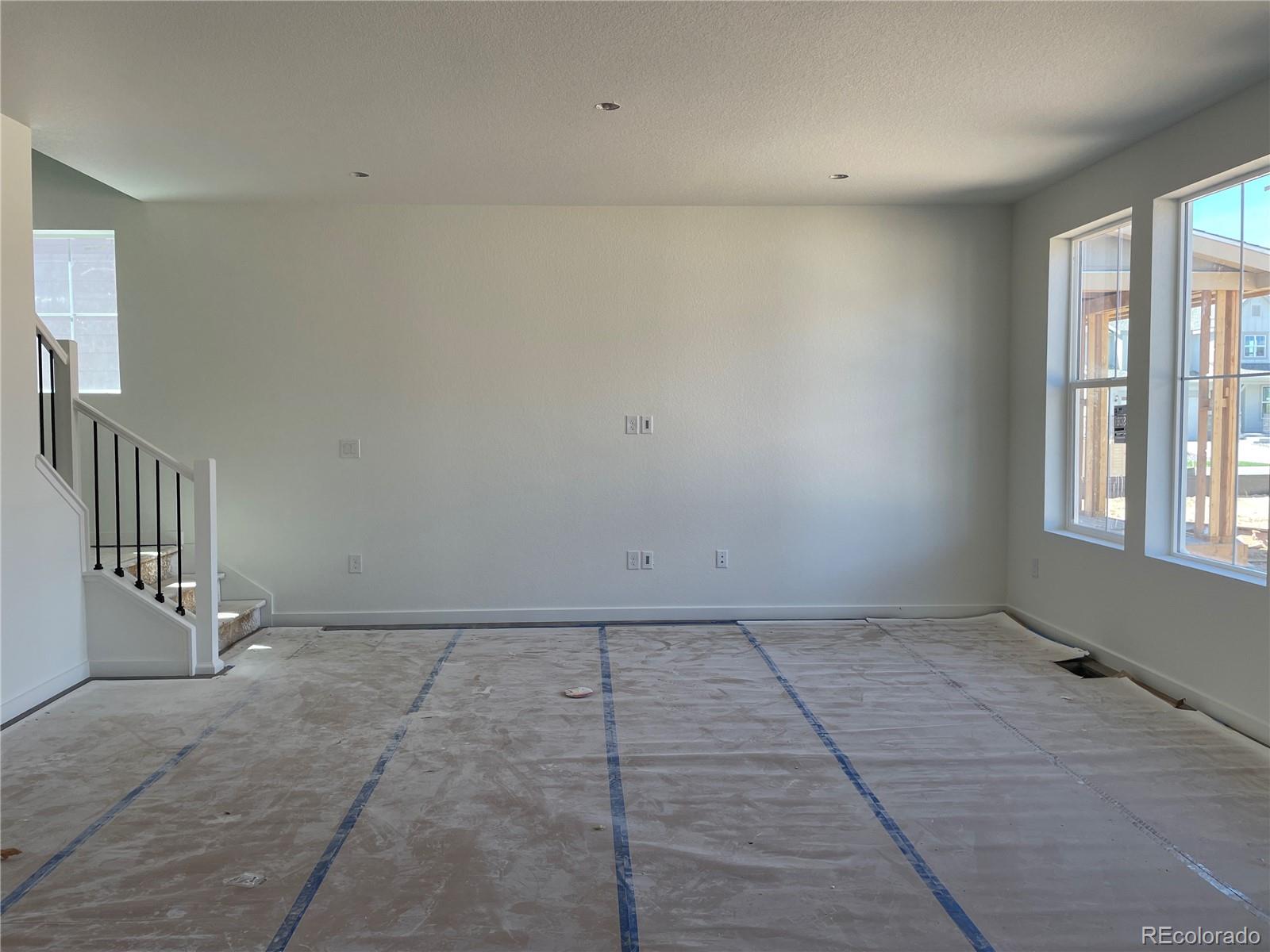 743 Clover Loop Erie, CO 80026 - Photo 3 of 15 a view of an empty room with windows
