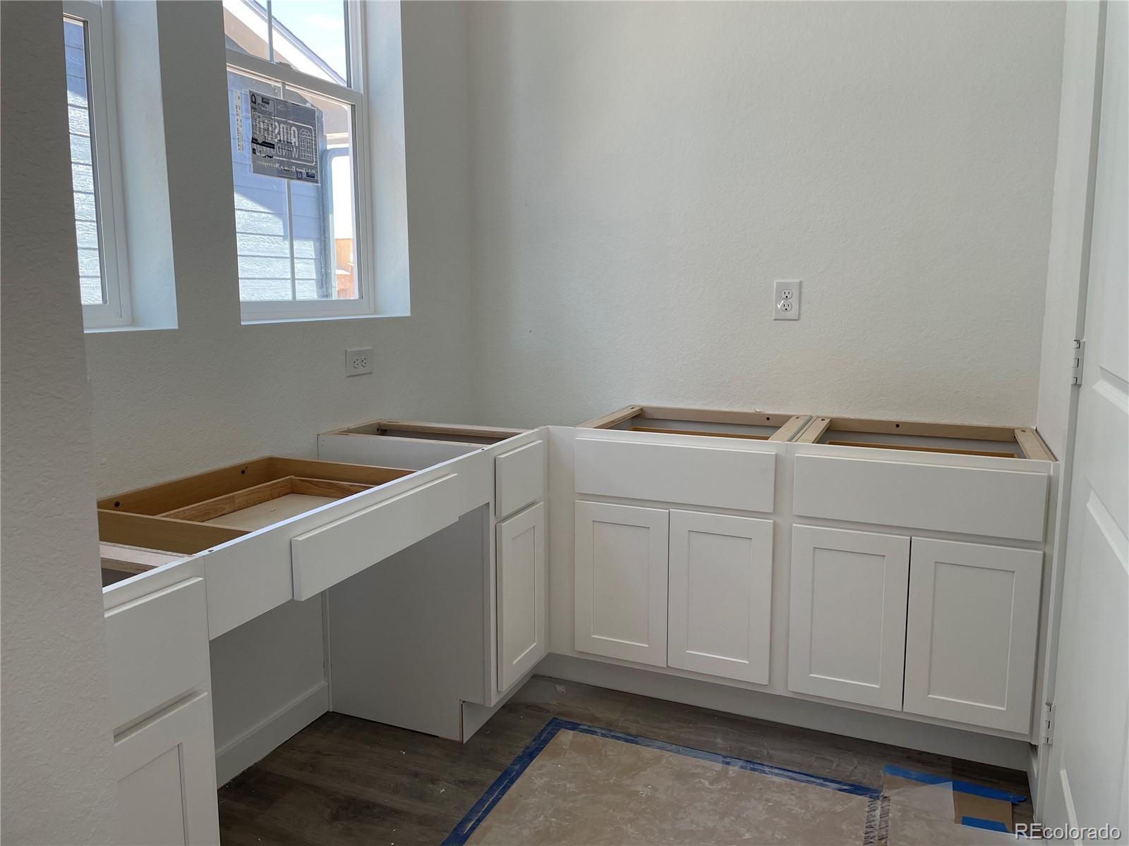 743 Clover Loop Erie, CO 80026 - Photo 4 of 15 a utility room with dryer and washer