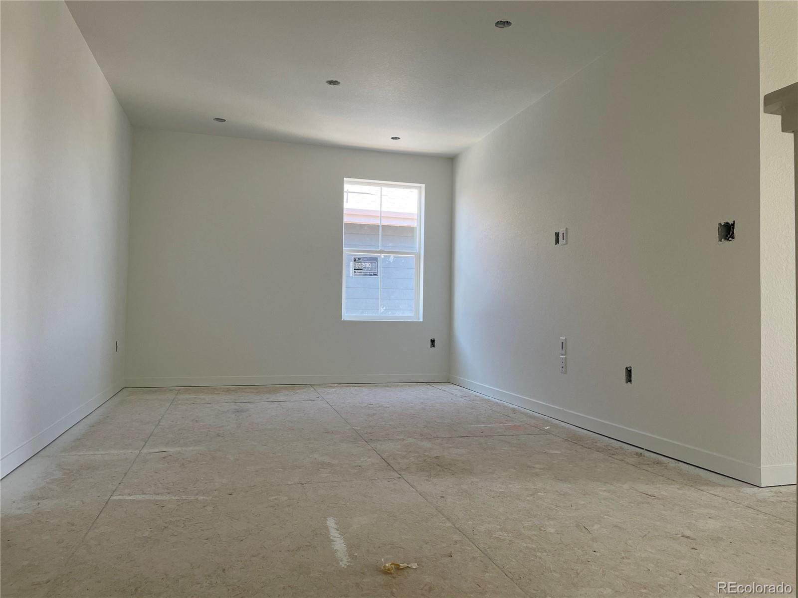 743 Clover Loop Erie, CO 80026 - Photo 5 of 15 a view of an empty room with a window