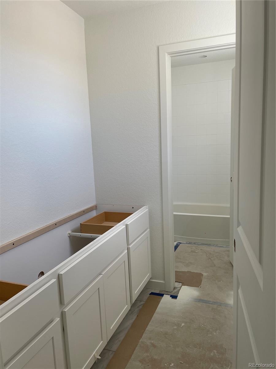 743 Clover Loop Erie, CO 80026 - Photo 6 of 15 a room with storage and utility