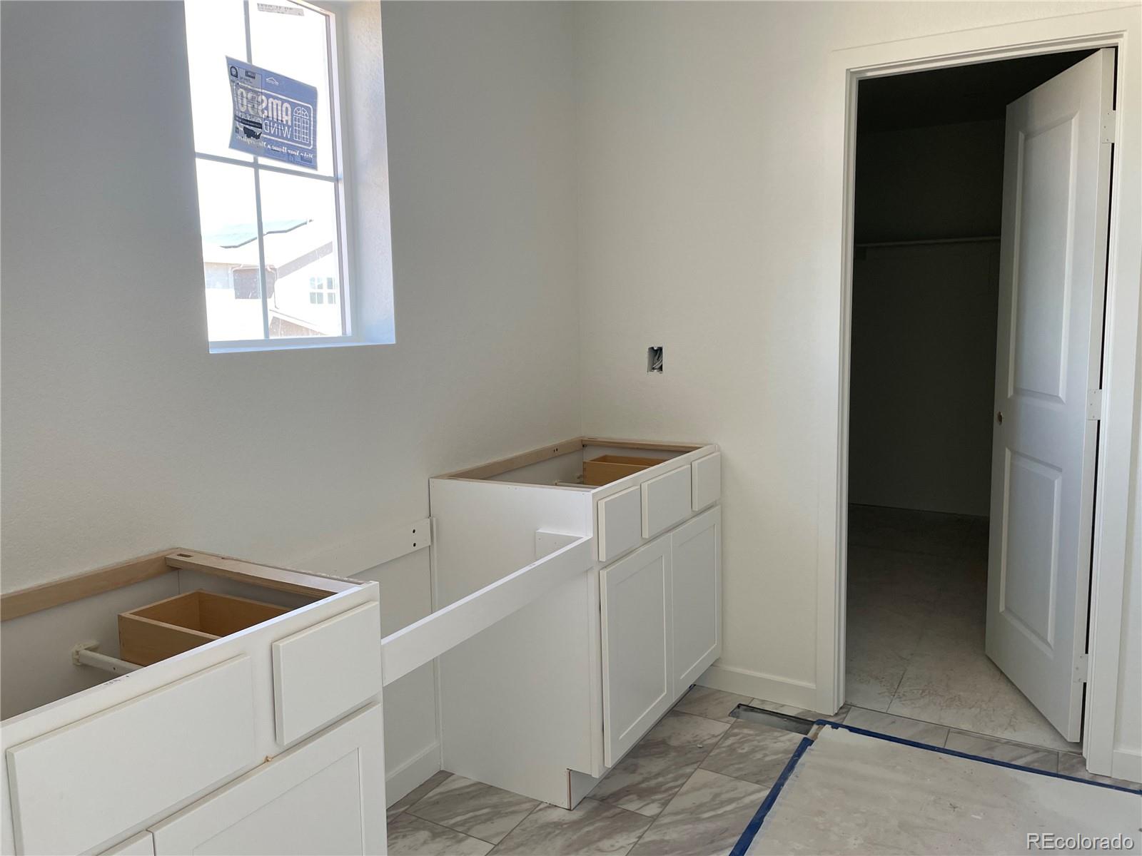 743 Clover Loop Erie, CO 80026 - Photo 7 of 15 a utility room with dryer and washer