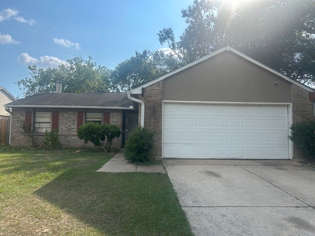22831 Millgate Drive Spring, TX 77373 - Photo 1 of 9 a front view of a house with a yard and garage