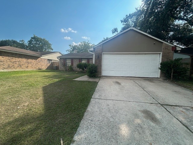 22831 Millgate Drive Spring, TX 77373 - Photo 2 of 9 a front view of house with yard and green space