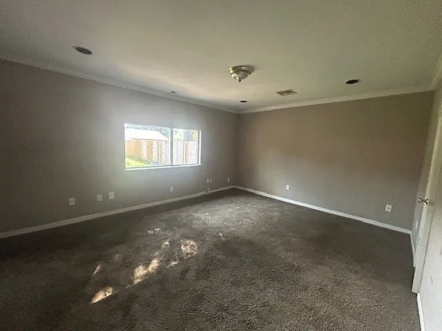 an empty room that has a window in it