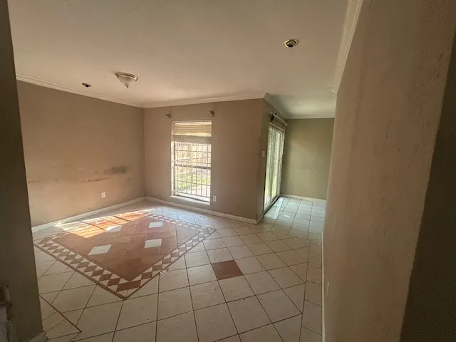 a view of an empty room and window