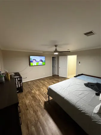 a view of a room with wooden floor