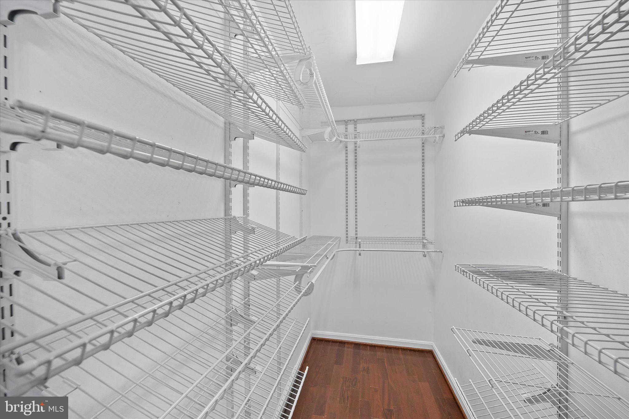 9253 Cardinal Forest Lane, Unit 101 Lorton, VA 22079 - Photo 11 of 29 a view of a room with wooden floor and staircase